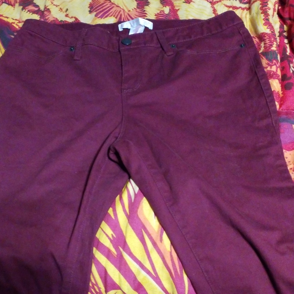 Maroon jeans.